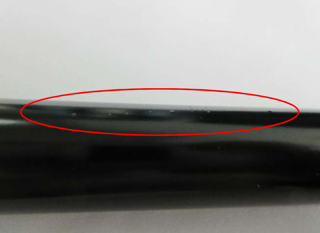 Close-up of gas spring piston rod showing no rust after 96 hours